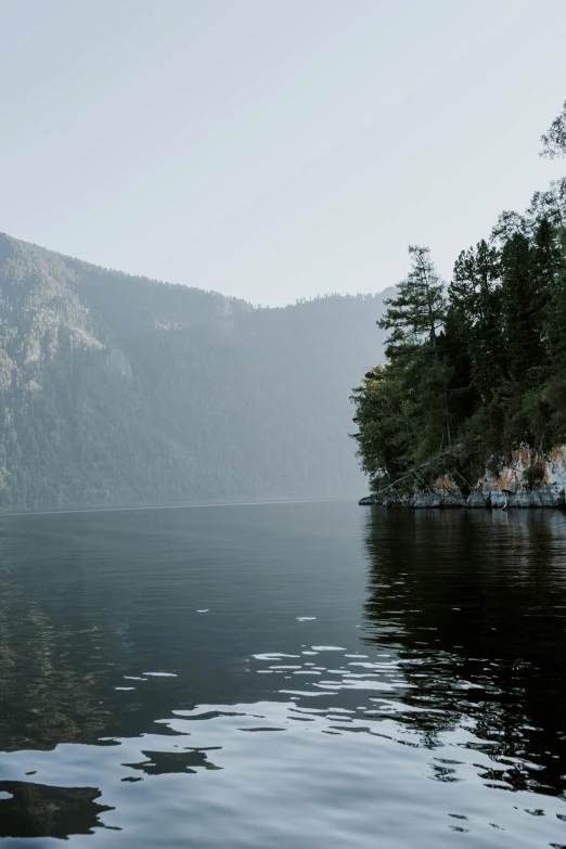 mountains sit in the distance with an almost empty body of water