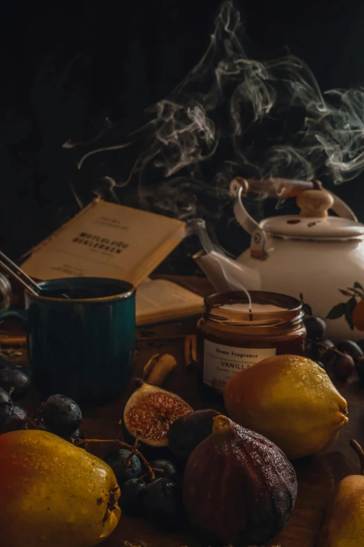 a collection of items that include fruit, honey and tea