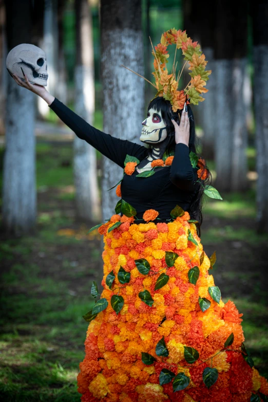 a woman with skeleton makeup in a flower dress