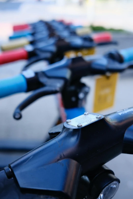 several bikes lined up on a paved street