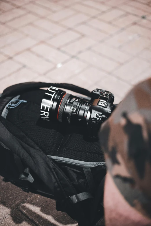 a backpack is shown with a small water bottle on top of it