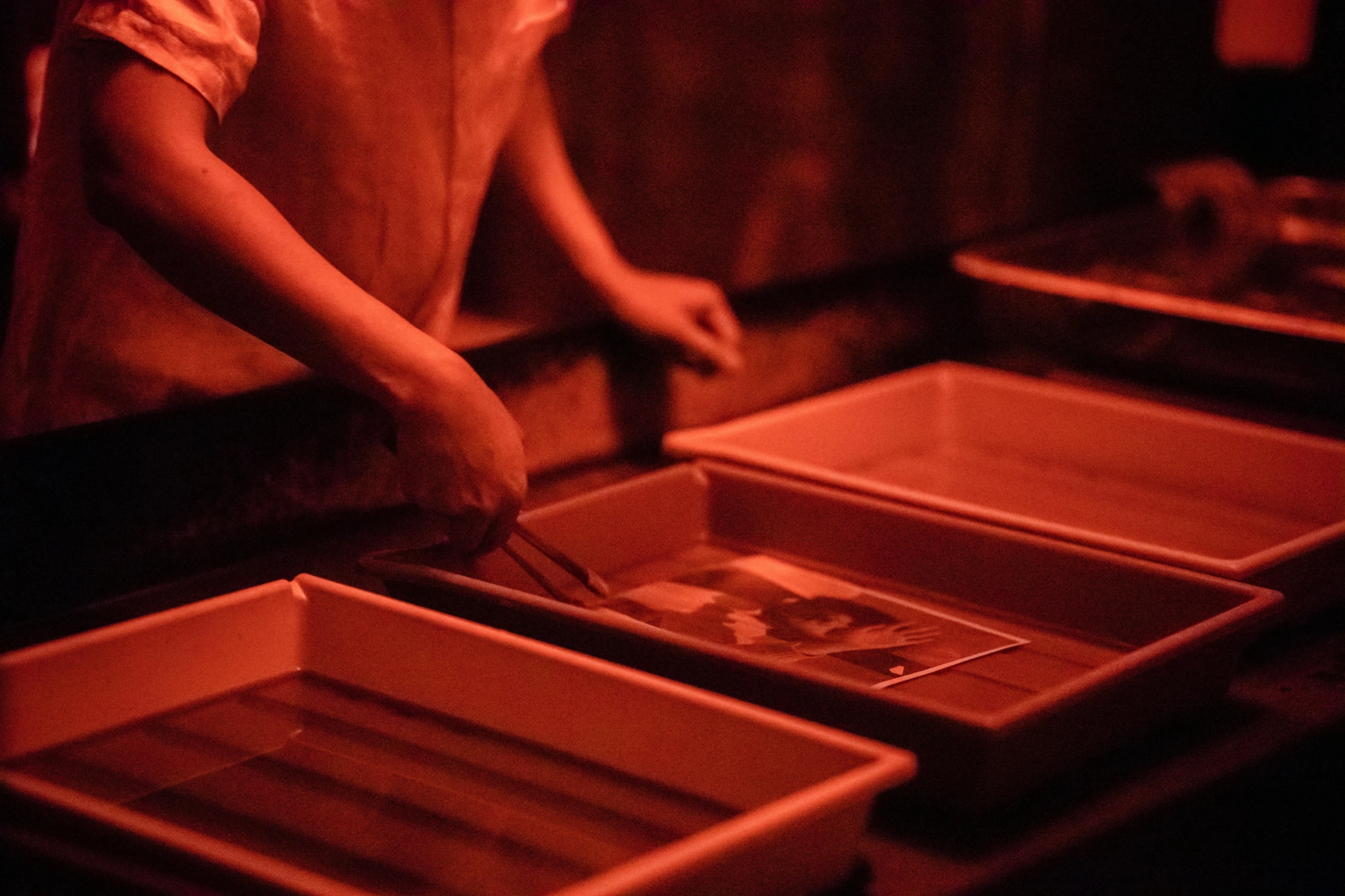 a woman is getting food out of an open box