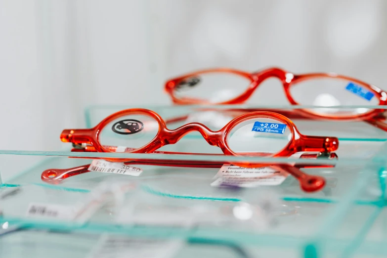 red glasses with the label of a store