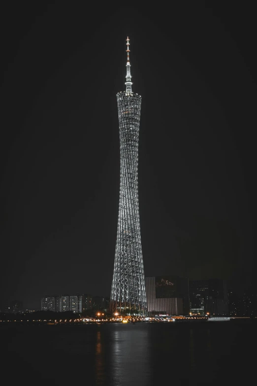 the tower is lit with lights at night