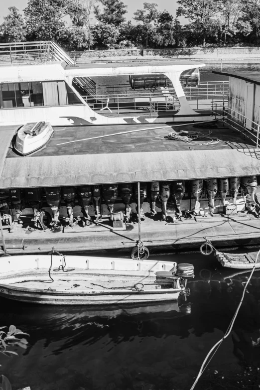 a boat docked next to a building on the river