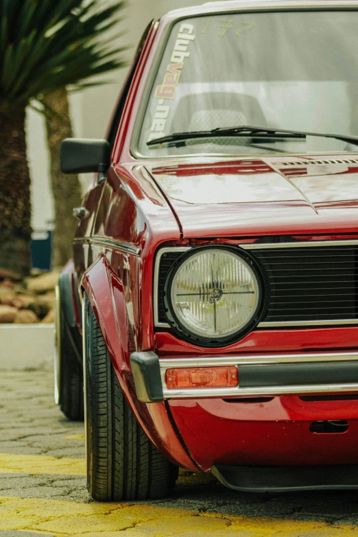 the front grilles of a car parked on a street