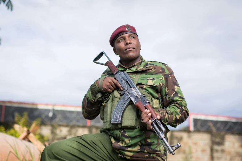 an indian soldier with a gun and a hat