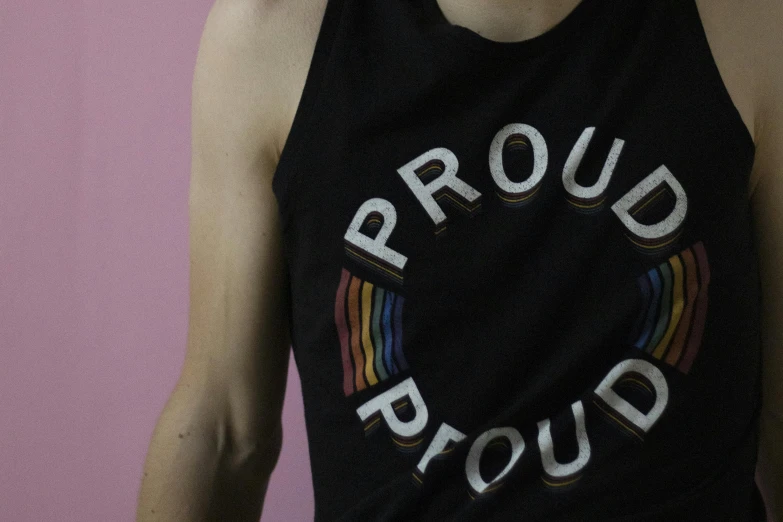 a woman wearing a t - shirt that reads proud