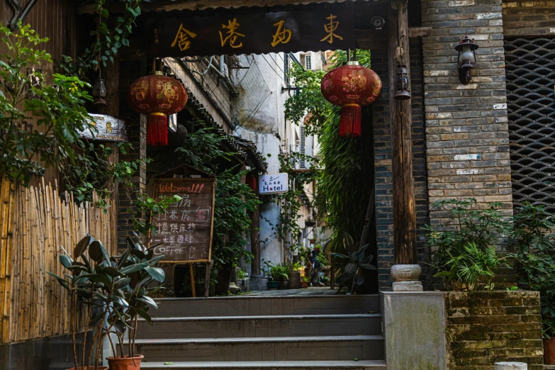 an asian style entrance with flowers and chinese lanterns