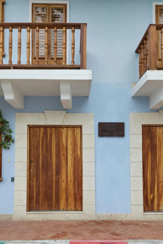 two doors on the front of a building