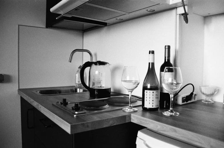 black and white pograph of a sink and stove