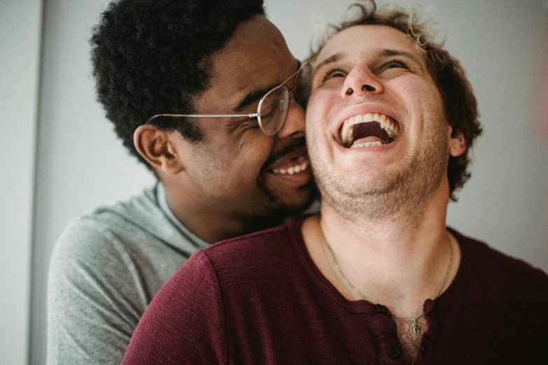 two men are having fun laughing together