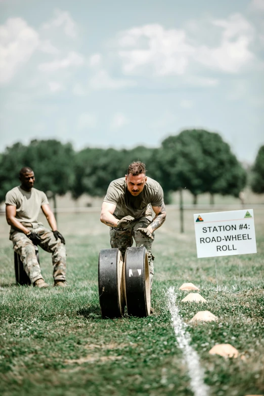 two soldiers with a machine gun on the grass