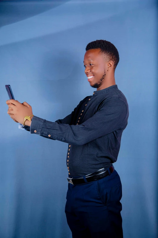 a young man is using a cell phone