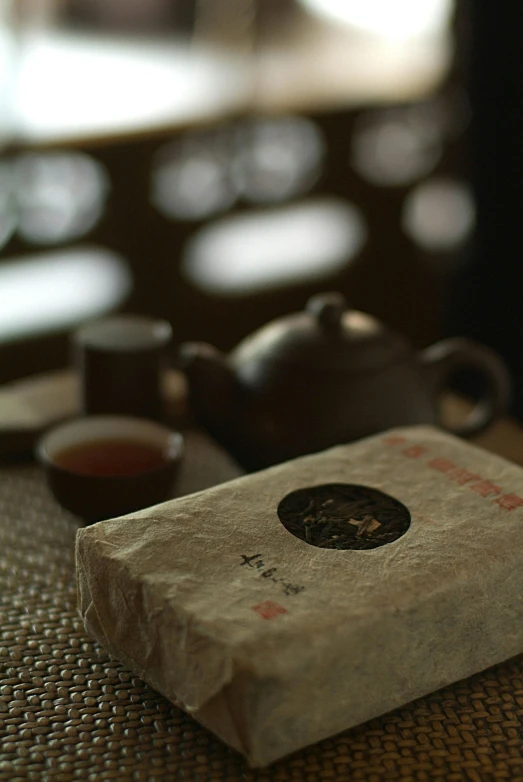 a box with the word tea is on a table