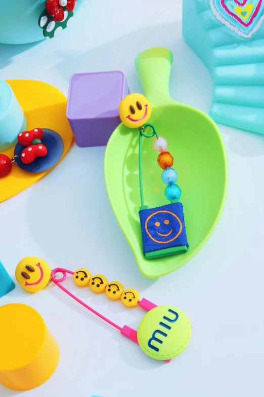 a variety of colorful toys sitting on top of a white table