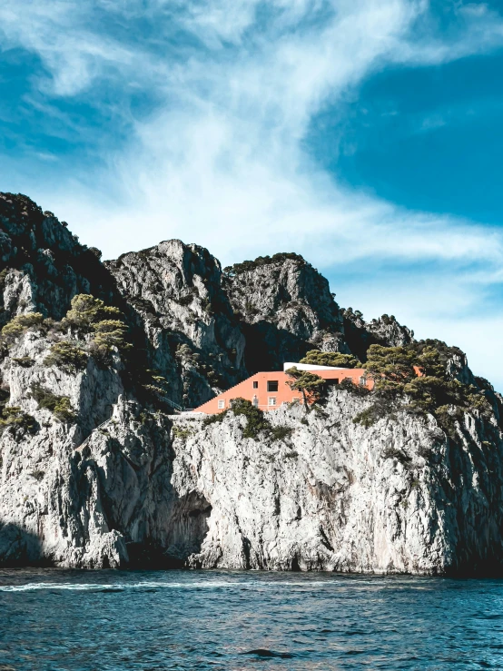 a small island sits on the coast in the background