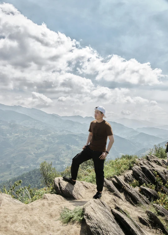 a person standing on a mountain above the terrain