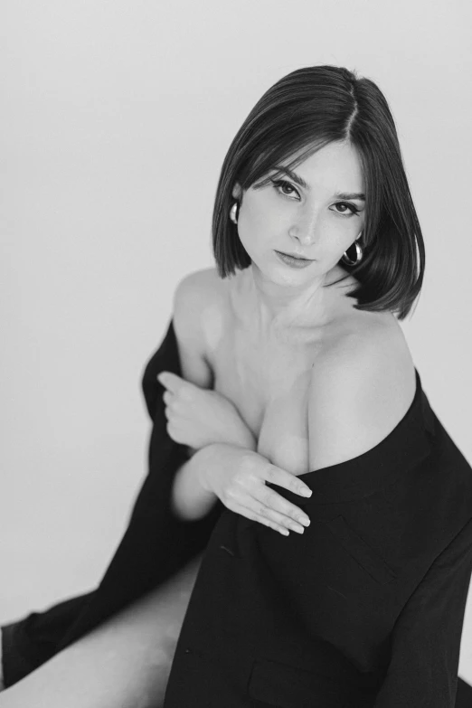 black and white pograph of woman wearing off the shoulder top