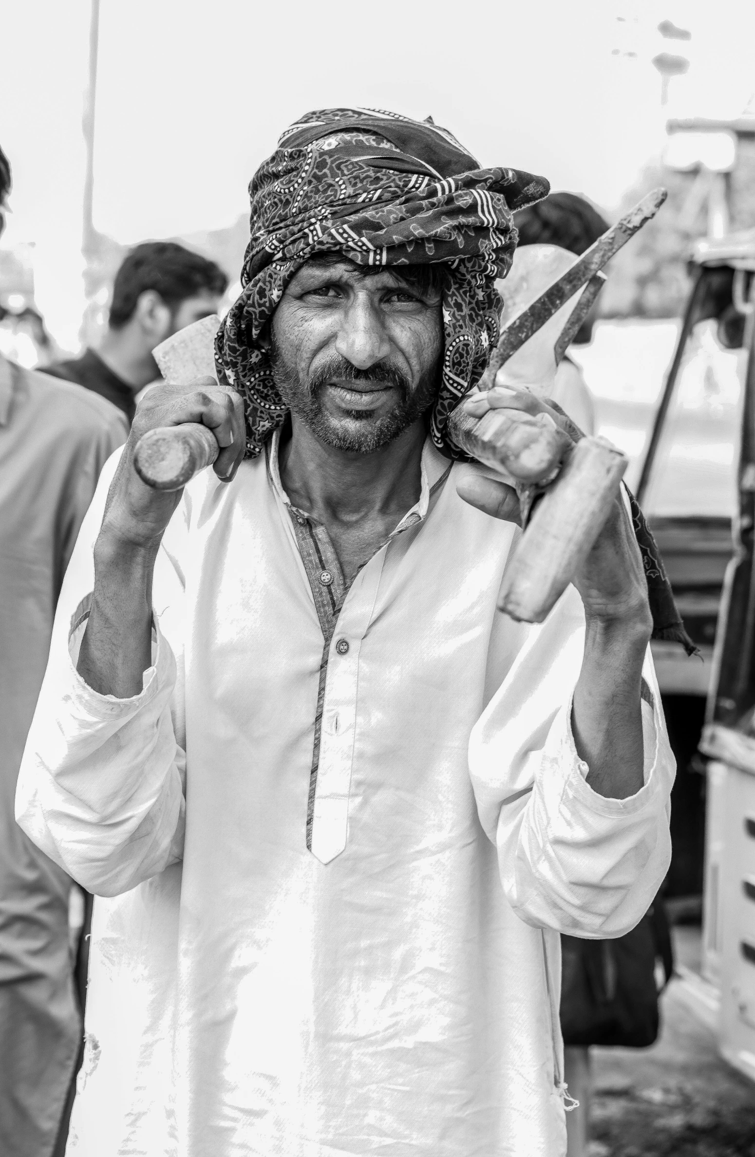 a person in a white shirt holding scissors