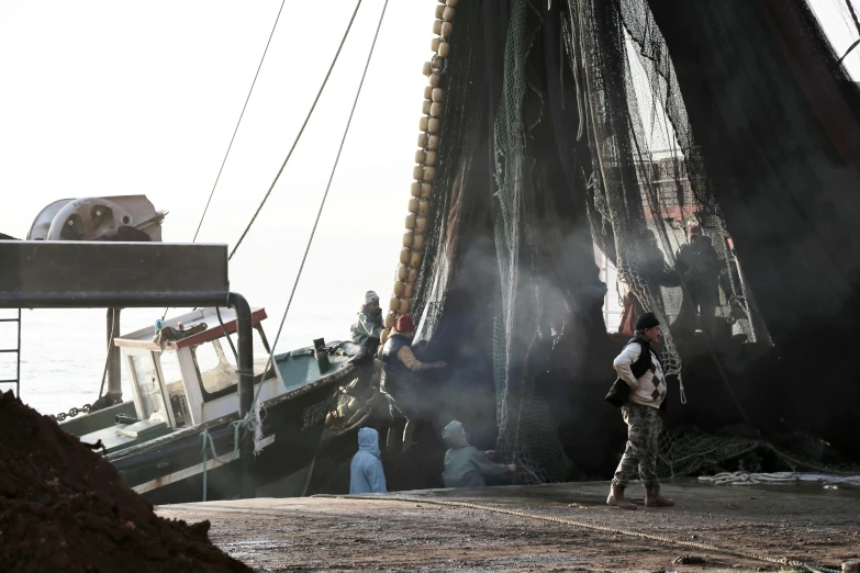 a group of people walking around a large ship