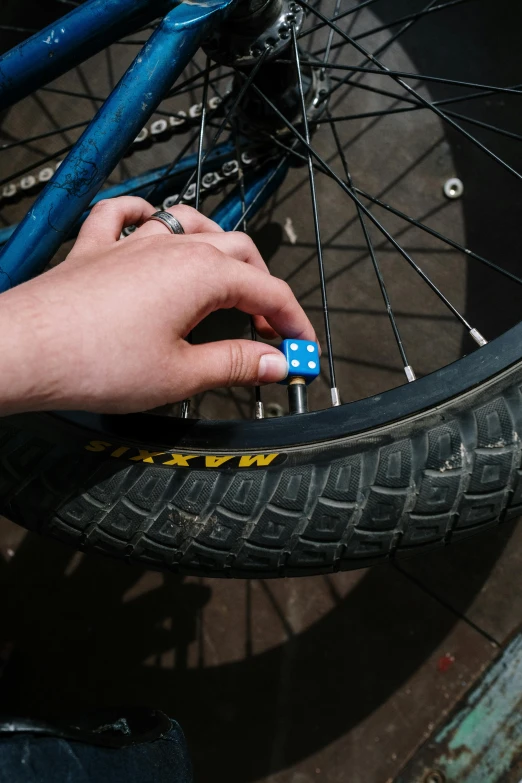 a person placing an object on a tire