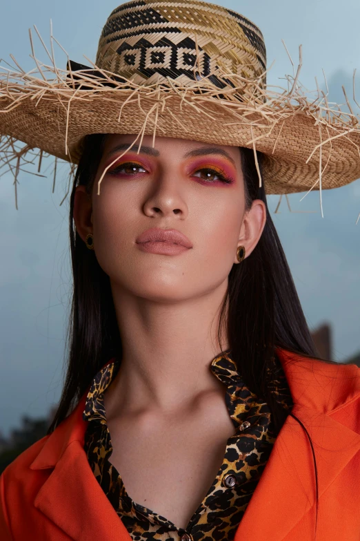 a woman wearing a hat is pictured with her eyes closed