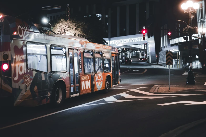 a passenger bus that is sitting in the street