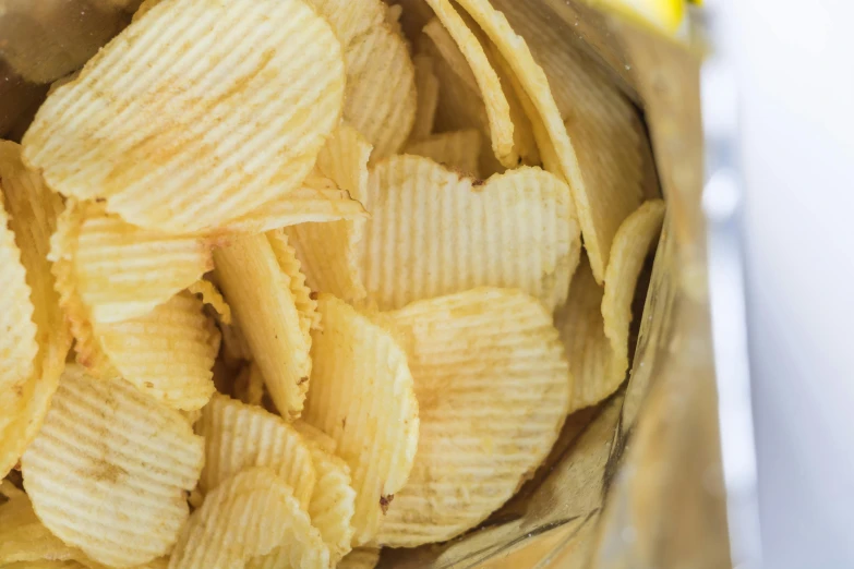 a pile of crispy potato chips in a bowl