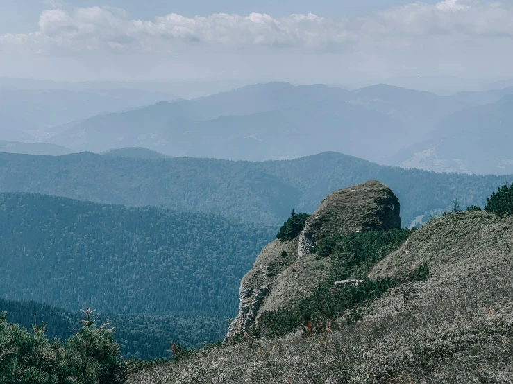 mountain peaks as seen from top of hill