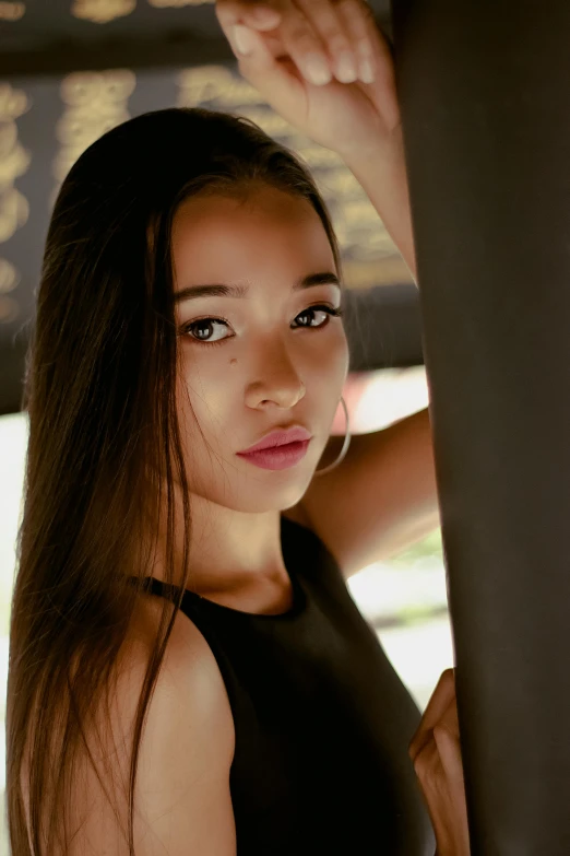 a young woman poses for the camera