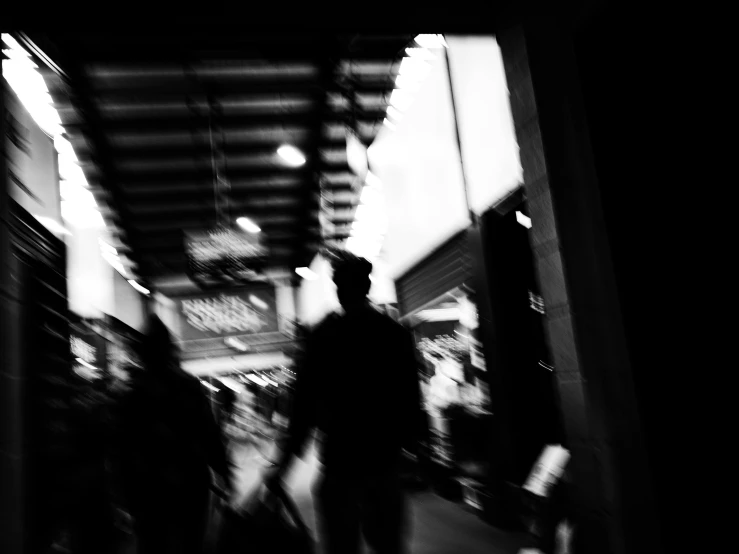 a group of people walking down a dark street