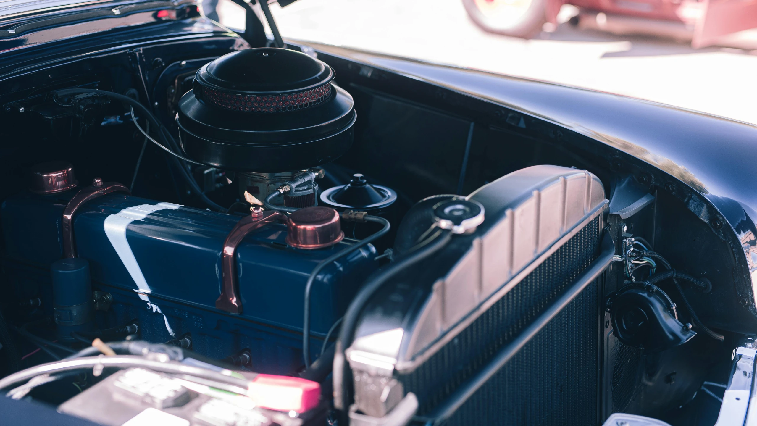 a car's engine is being worked on by an auto shop