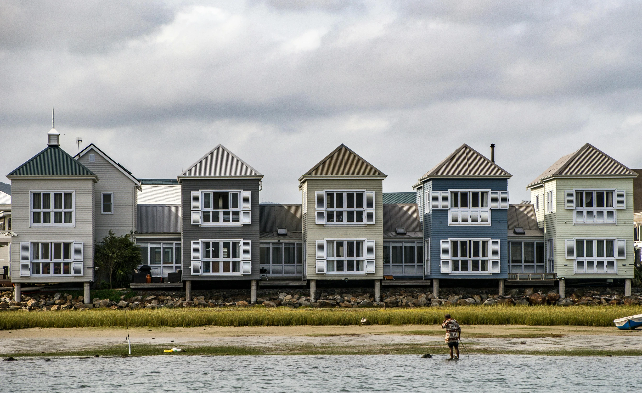 a beachfront with many houses along it's coast