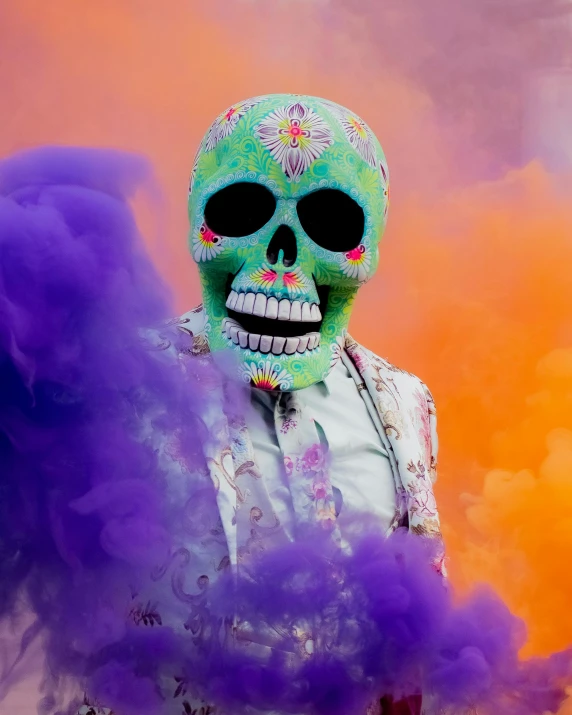 a man wearing a green and purple skull mask