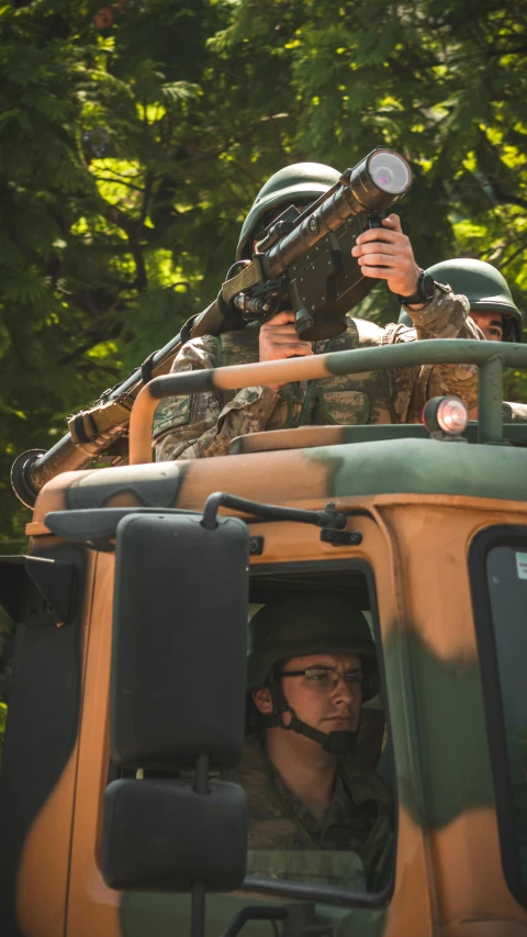 the soldiers are riding in their jeep