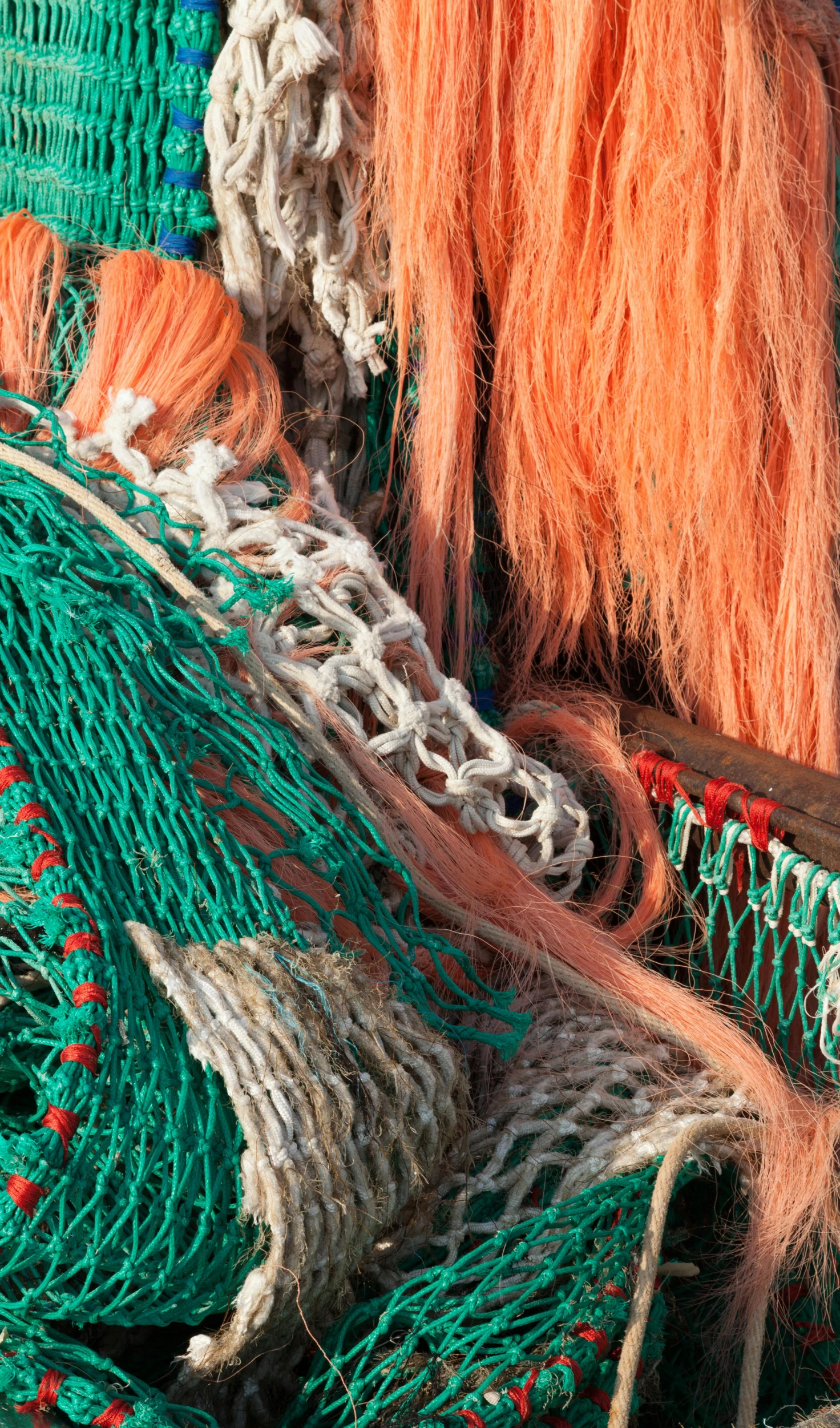 several different colored mesh fishing nets