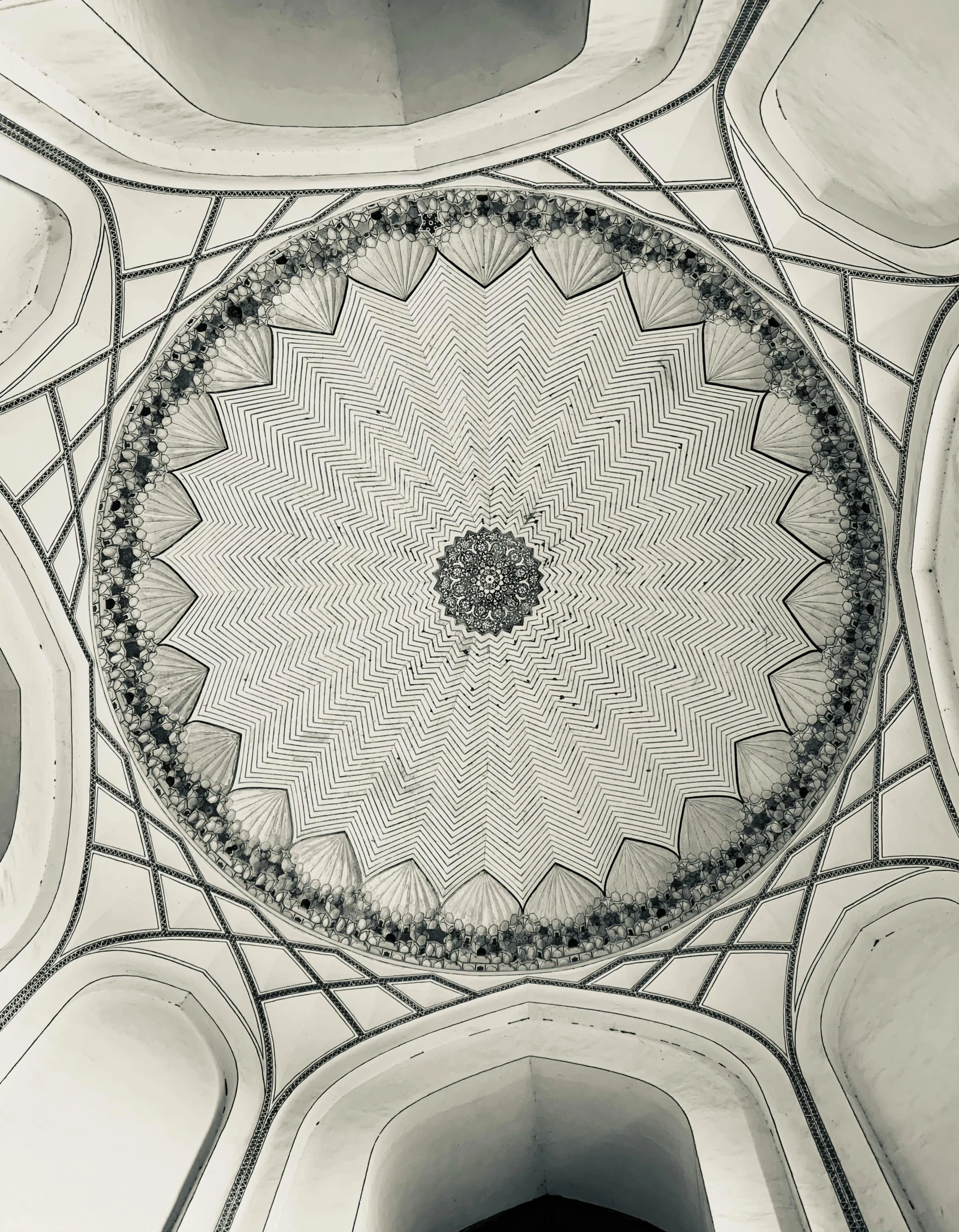 the ceiling of an ancient building with designs and a circular design