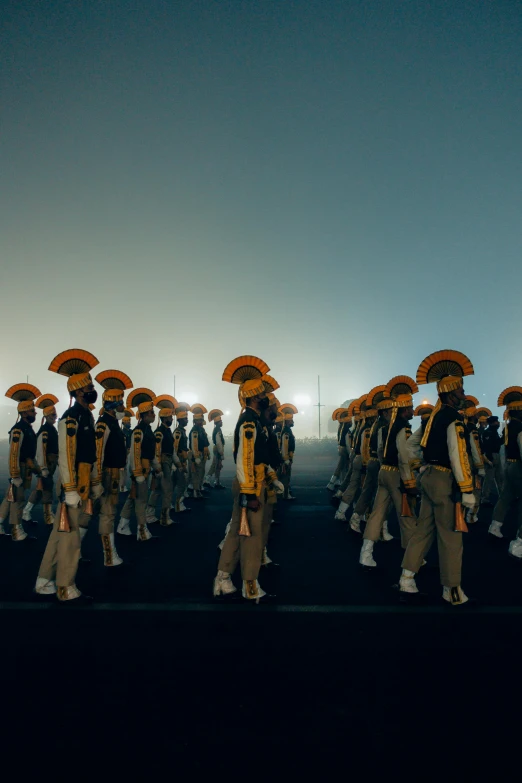 a group of people carrying umbrellas standing next to each other