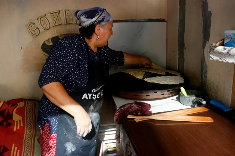 a man looking at soing in a food stall