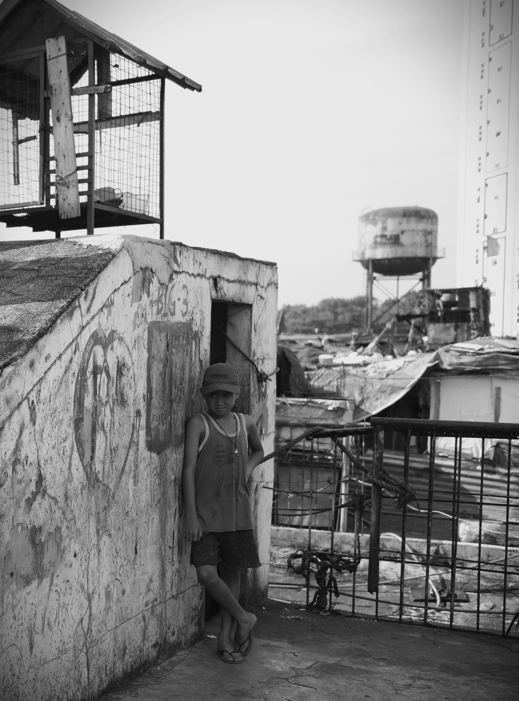 a man standing outside a bird house