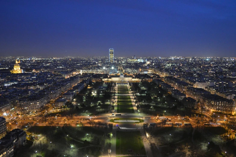 an aerial view of the eiffel tower and the city at night