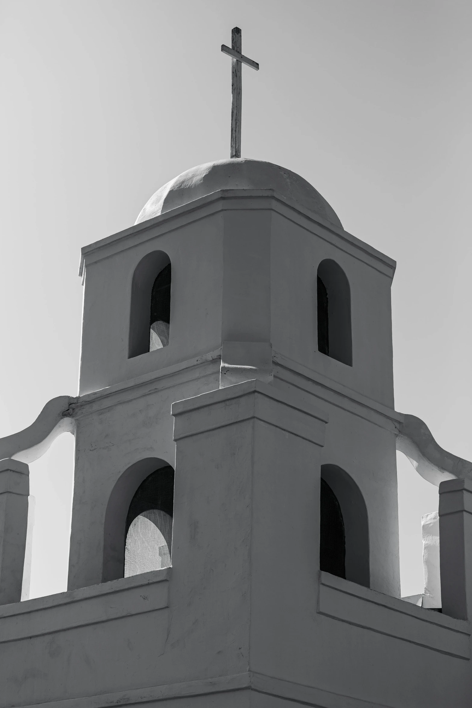 a very large white building with a cross