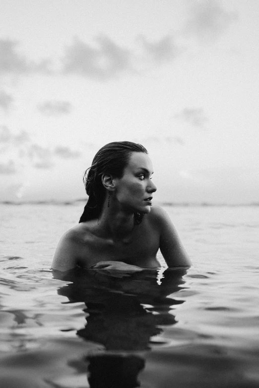 a black and white po of a woman in the water