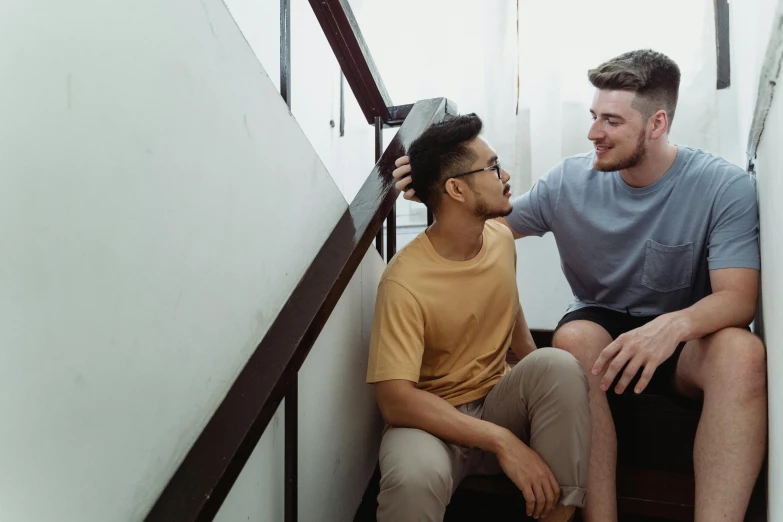 two guys having fun getting ready for their haircut