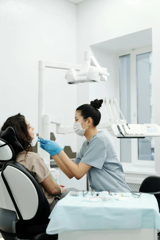 a person in a dentist chair getting dental care