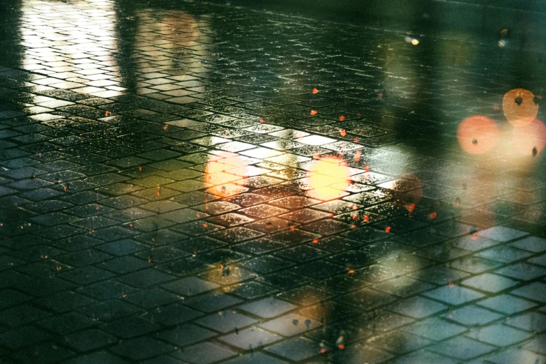 a close up of a umbrella and a dle with water droplets