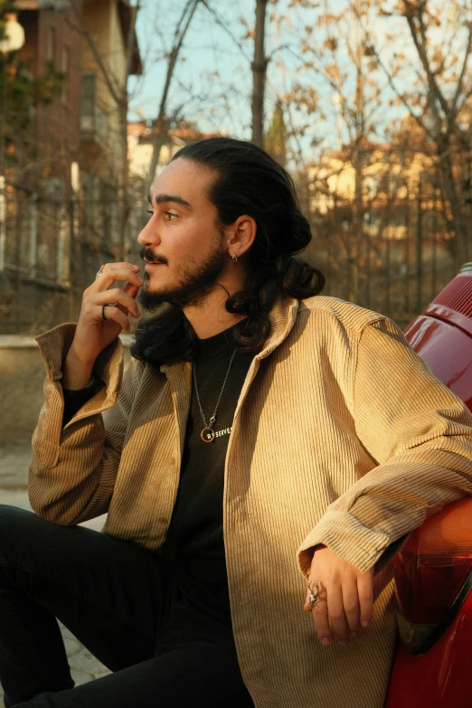 a man smoking and sitting down on a bench