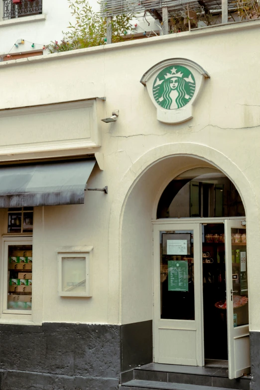 a starbucks shop front and entrance is pictured