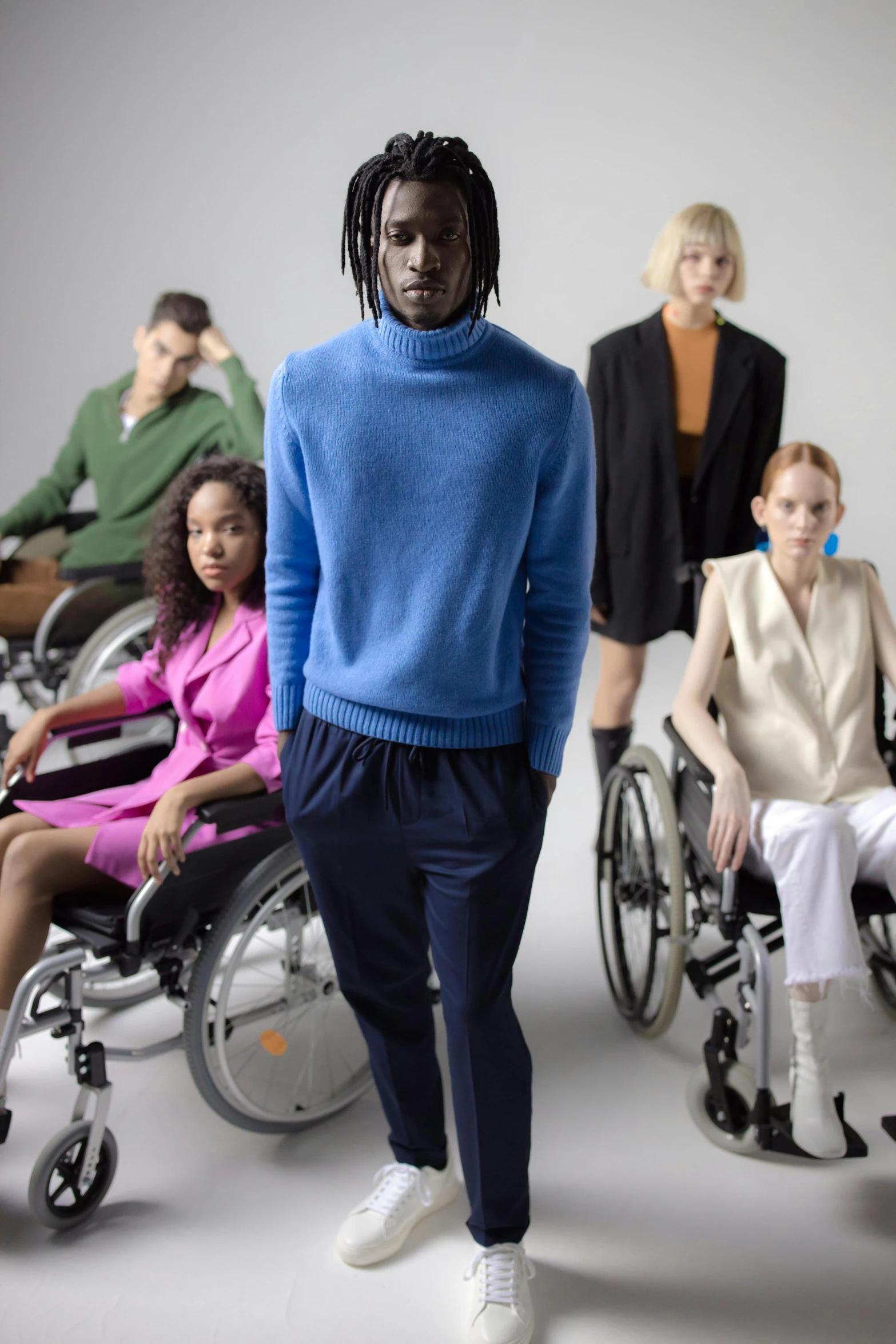 people in wheelchairs with a face covered by sweats and socks